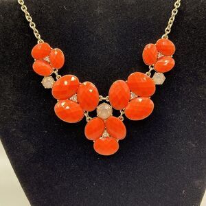 Bauble Box gold toned and coral colored statement necklace